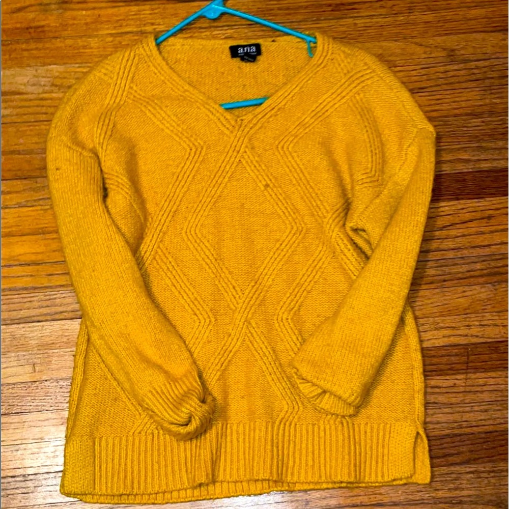 Brand is Ana, it is a medium, and mustard yellow.